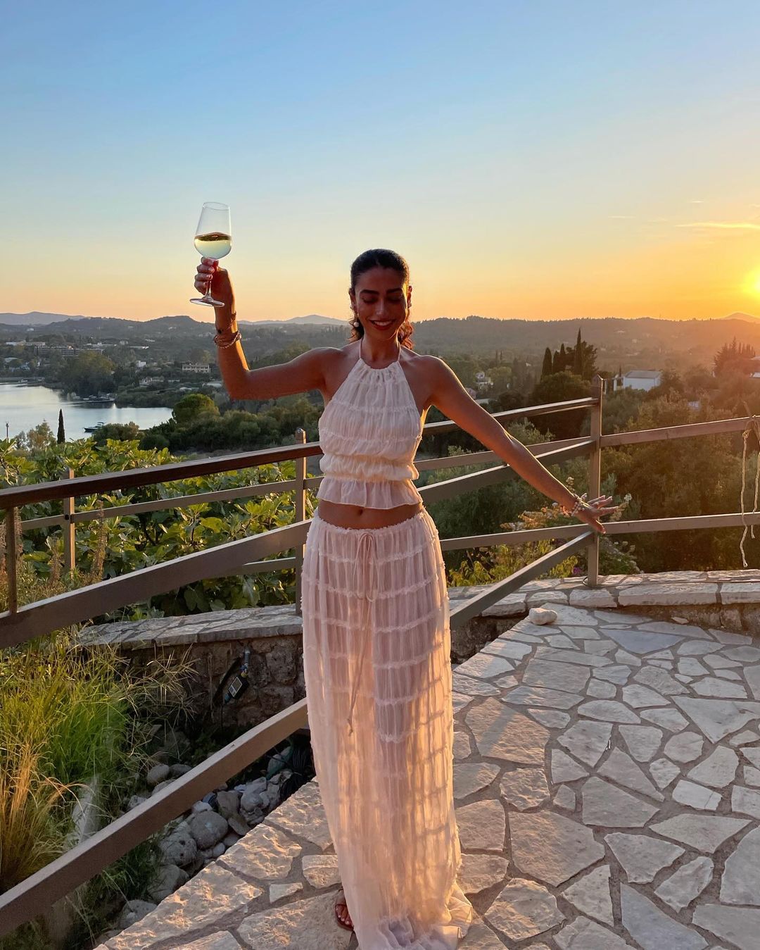 White-hot_elegance_at_sunset._Cheers_in_the_Rosalie_Backless_Set_sunferestyle_whiteset_Bestseller_love_SunsetVibes.jpg